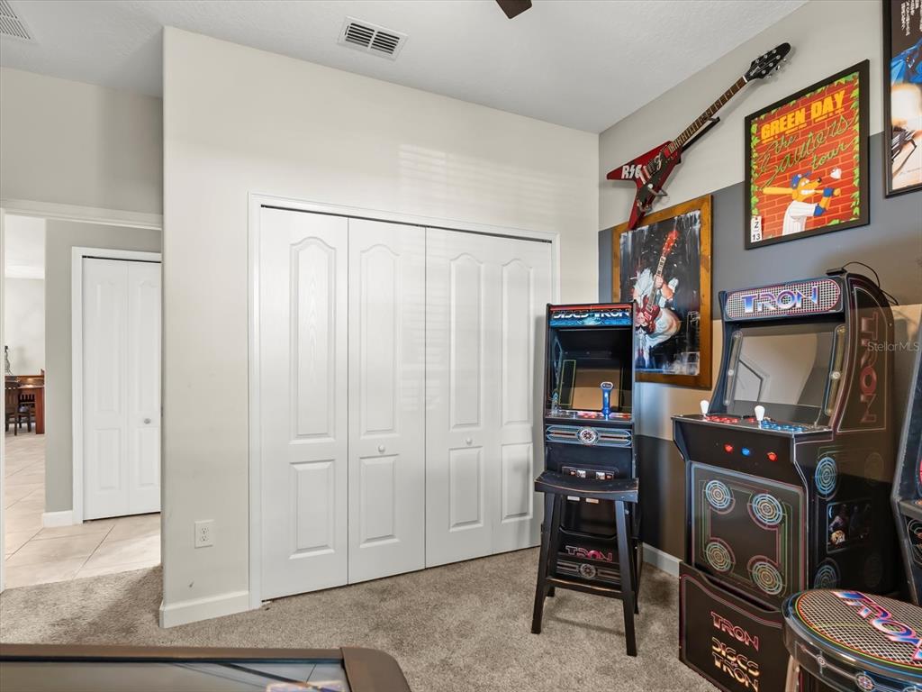 15433 Porter Road Winter Garden, FL 34787 - Photo 17 of 46 a living room with furniture and a flat screen tv