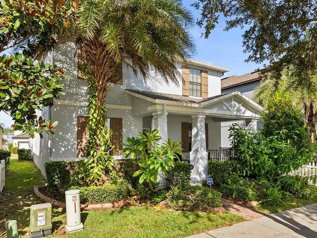 front view of a house with a garden