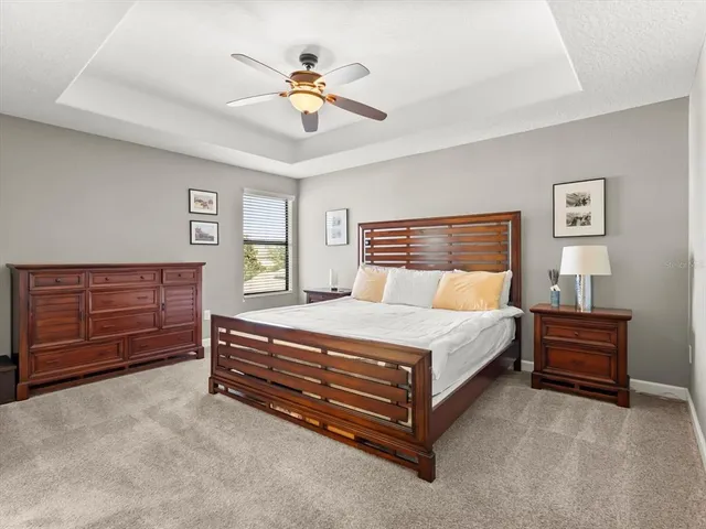 a bedroom with a bed and dresser
