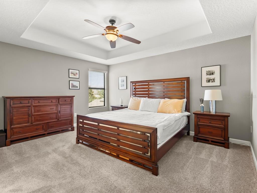 15433 Porter Road Winter Garden, FL 34787 - Photo 23 of 46 a bedroom with a bed and dresser