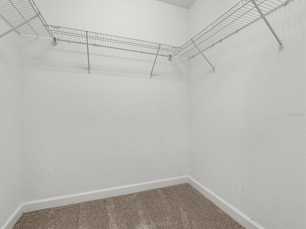 15433 Porter Road Winter Garden, FL 34787 - Photo 27 of 46 a view of a room with racks on the wall