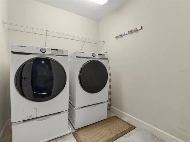 a utility room with dryer and washer