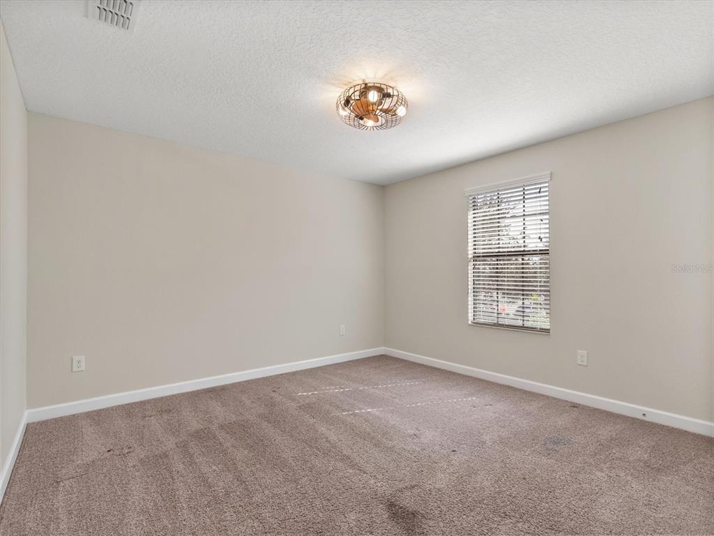 15433 Porter Road Winter Garden, FL 34787 - Photo 32 of 46 an empty room with windows