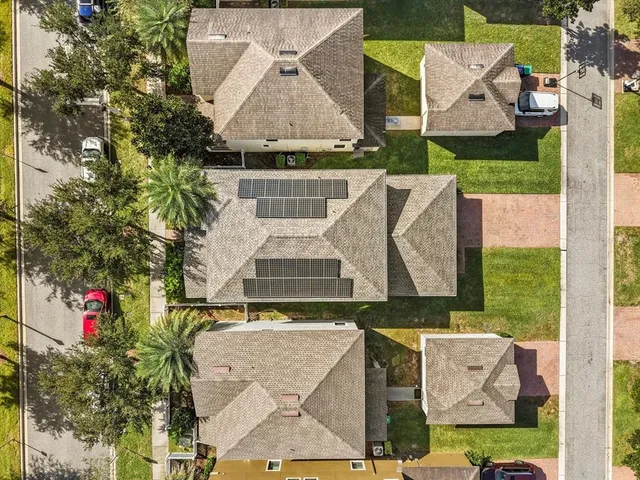 an aerial view of a house with outdoor space