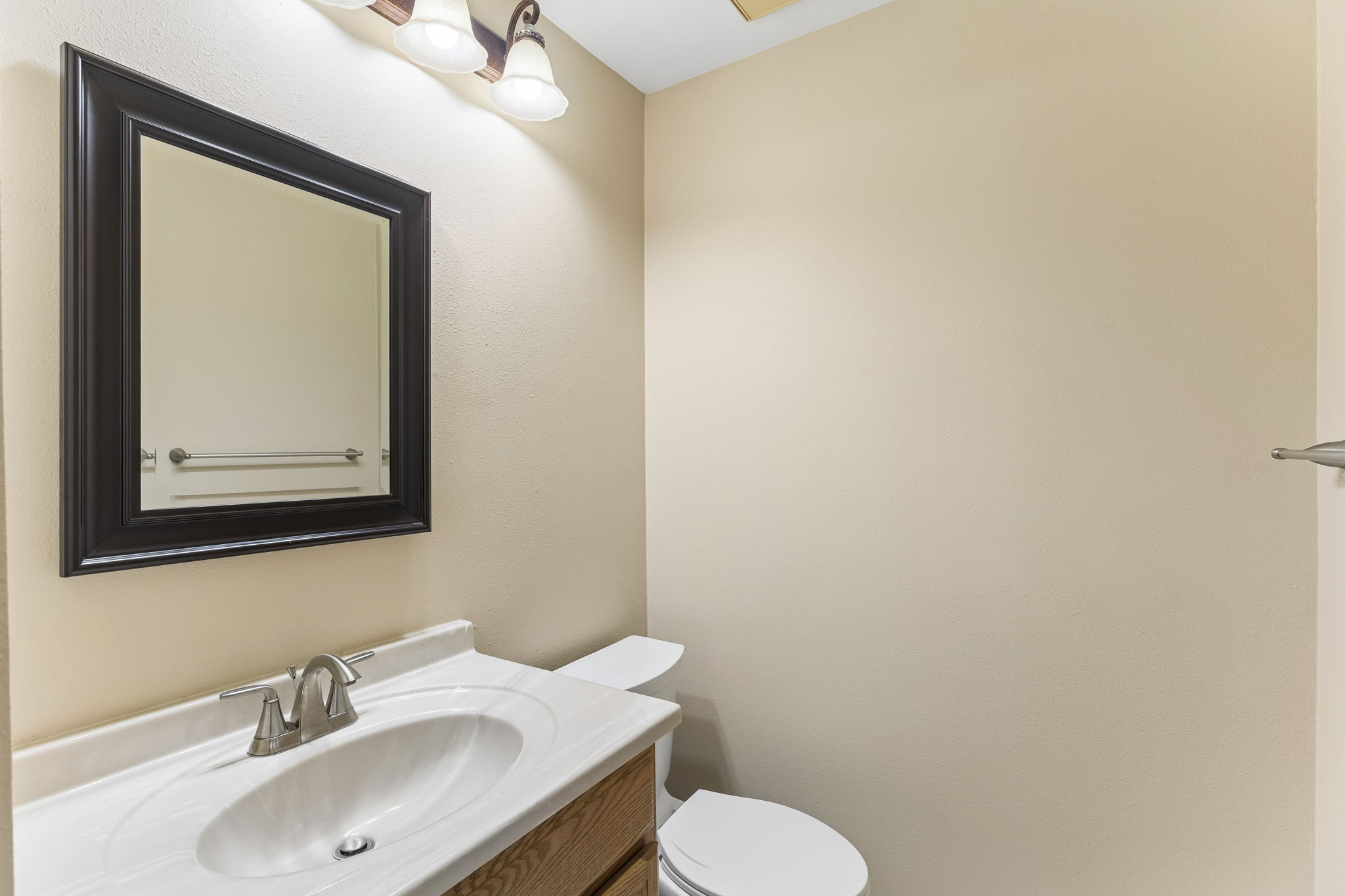 8340 Fathom Circle, Unit 103 Austin, TX 78750 - Photo 22 of 30 a bathroom with a toilet sink and mirror