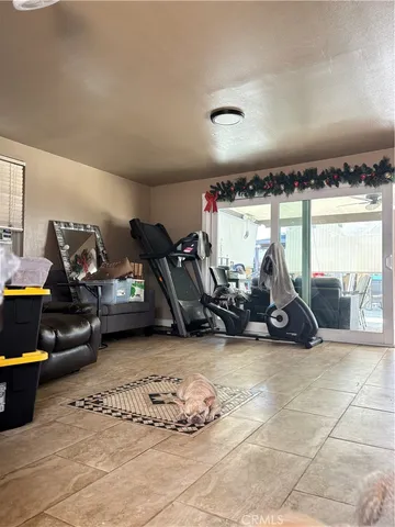 a view of a garage with a bike and wooden floors
