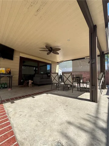 a view of a livingroom with furniture and a window