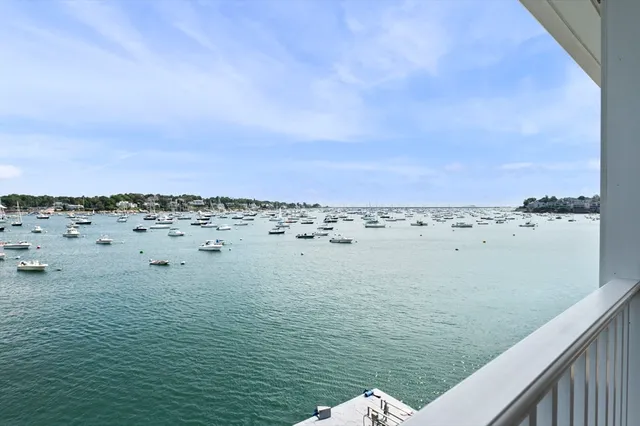 a kitchen with kitchen island a sink appliances and cabinets