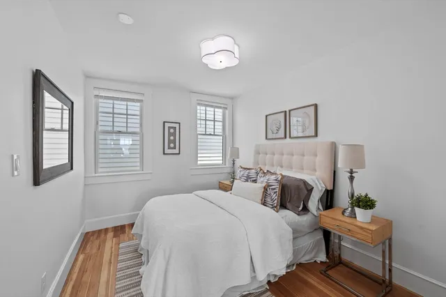 a bedroom with bed and window