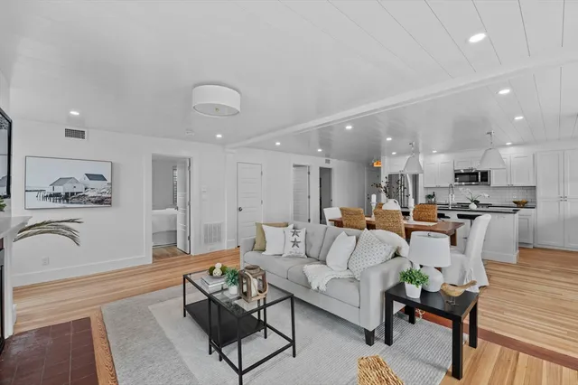 a view of a balcony with wooden floor