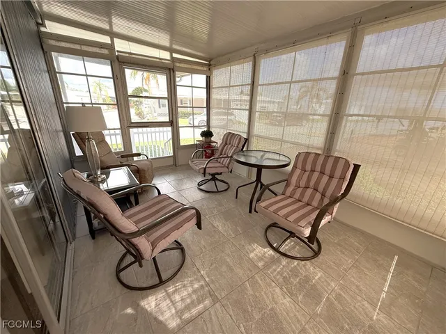 a view of a livingroom with furniture and windows