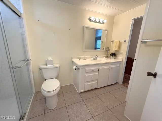 a bathroom with a sink toilet and mirror