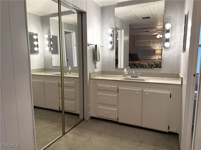 a bathroom with a shower and a sink