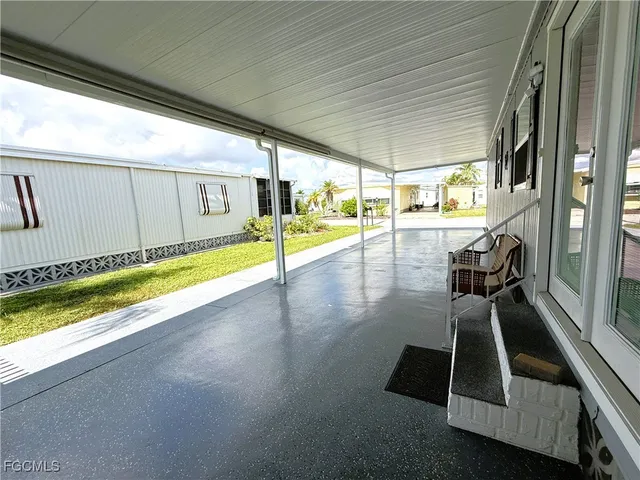 a view of swimming pool with seating area
