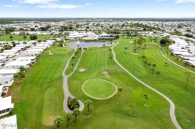 a view of a swimming pool and a yard