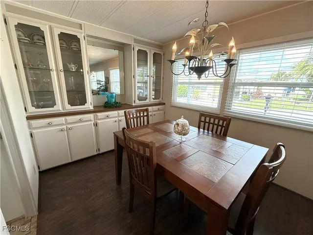 a view of a dining room with furniture window and outside view