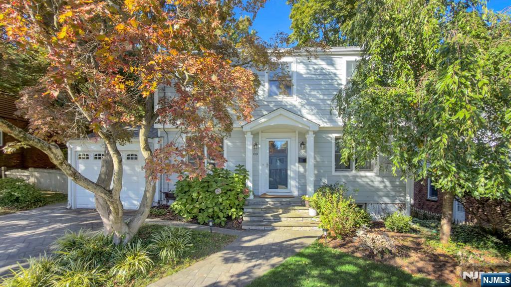 89 Surrey Lane Tenafly, NJ 07670 - Photo 1 of 49 a front view of a house with garden