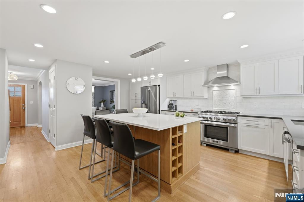 89 Surrey Lane Tenafly, NJ 07670 - Photo 12 of 49 a kitchen with a table and chairs in it