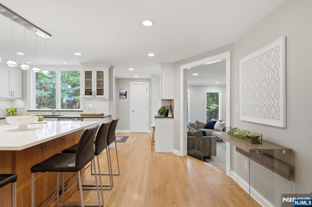 89 Surrey Lane Tenafly, NJ 07670 - Photo 15 of 49 a large white kitchen with lots of counter space and stainless steel appliances