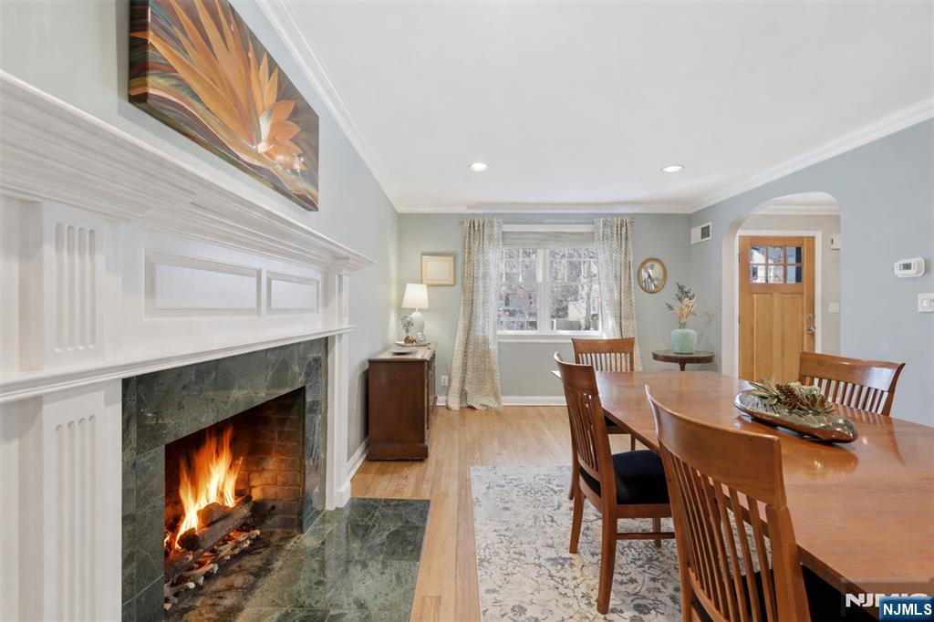 89 Surrey Lane Tenafly, NJ 07670 - Photo 25 of 49 a view of a dining room with furniture and a fireplace