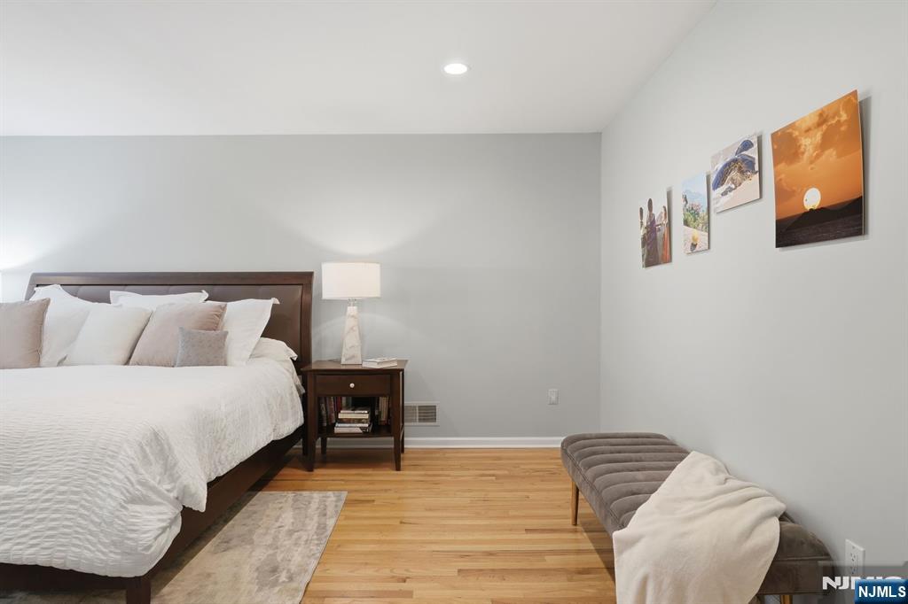 89 Surrey Lane Tenafly, NJ 07670 - Photo 28 of 49 a bedroom with bed and wooden floor