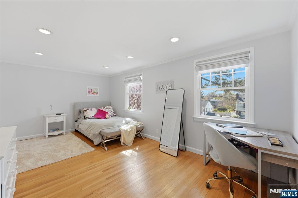 89 Surrey Lane Tenafly, NJ 07670 - Photo 36 of 49 a living room with furniture and a wooden floor