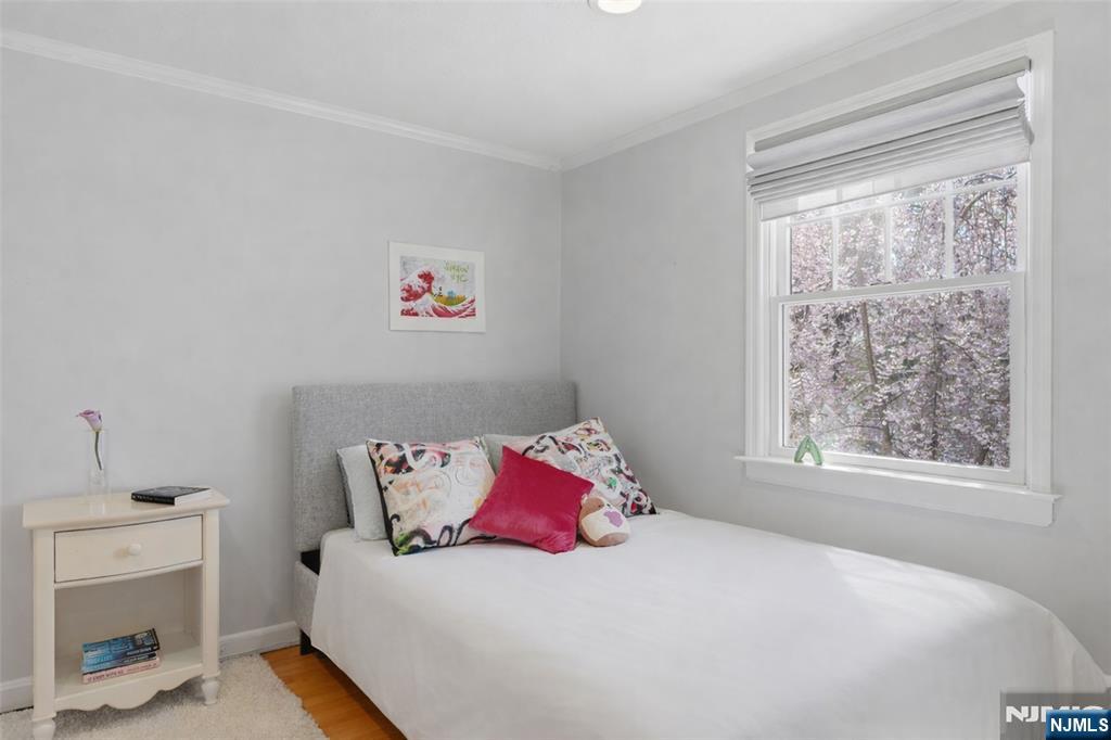 89 Surrey Lane Tenafly, NJ 07670 - Photo 38 of 49 a bedroom with a bed and a window
