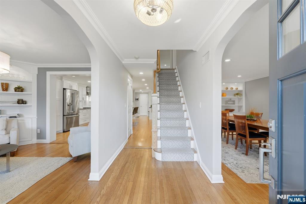 89 Surrey Lane Tenafly, NJ 07670 - Photo 4 of 49 a view of a hallway with wooden floor windows and a livingroom