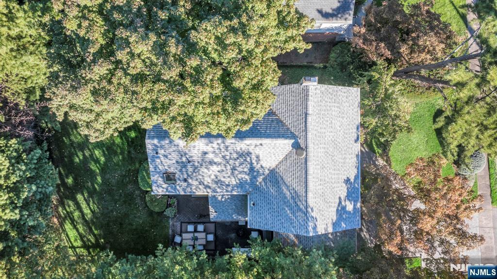 89 Surrey Lane Tenafly, NJ 07670 - Photo 46 of 49 an aerial view of a house with a yard and trees