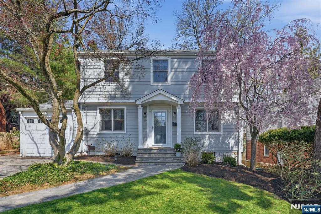 89 Surrey Lane Tenafly, NJ 07670 - Photo 48 of 49 front view of a house with a yard