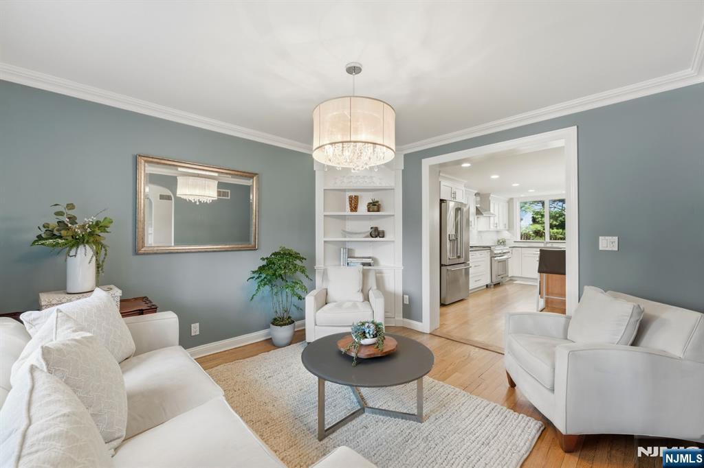 89 Surrey Lane Tenafly, NJ 07670 - Photo 8 of 49 a living room with furniture and a chandelier