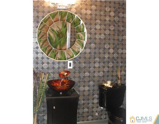 358 Rector Street, Unit STREET 703 Perth Amboy, NJ 08861 - Photo 6 of 10 a bathroom with a sink and a mirror