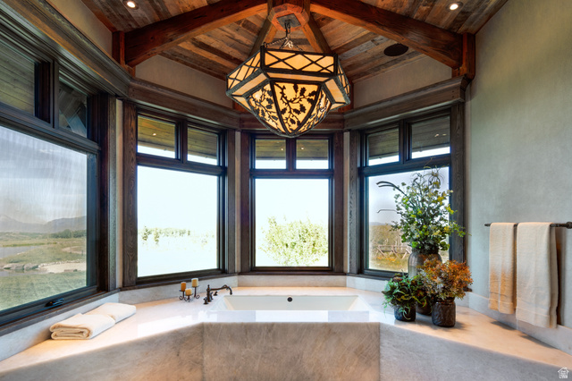2322 North Westward Ho Road Heber City, UT 84036 - Photo 14 of 54 Bathroom featuring a bath and a wooden ceiling with exposed beams