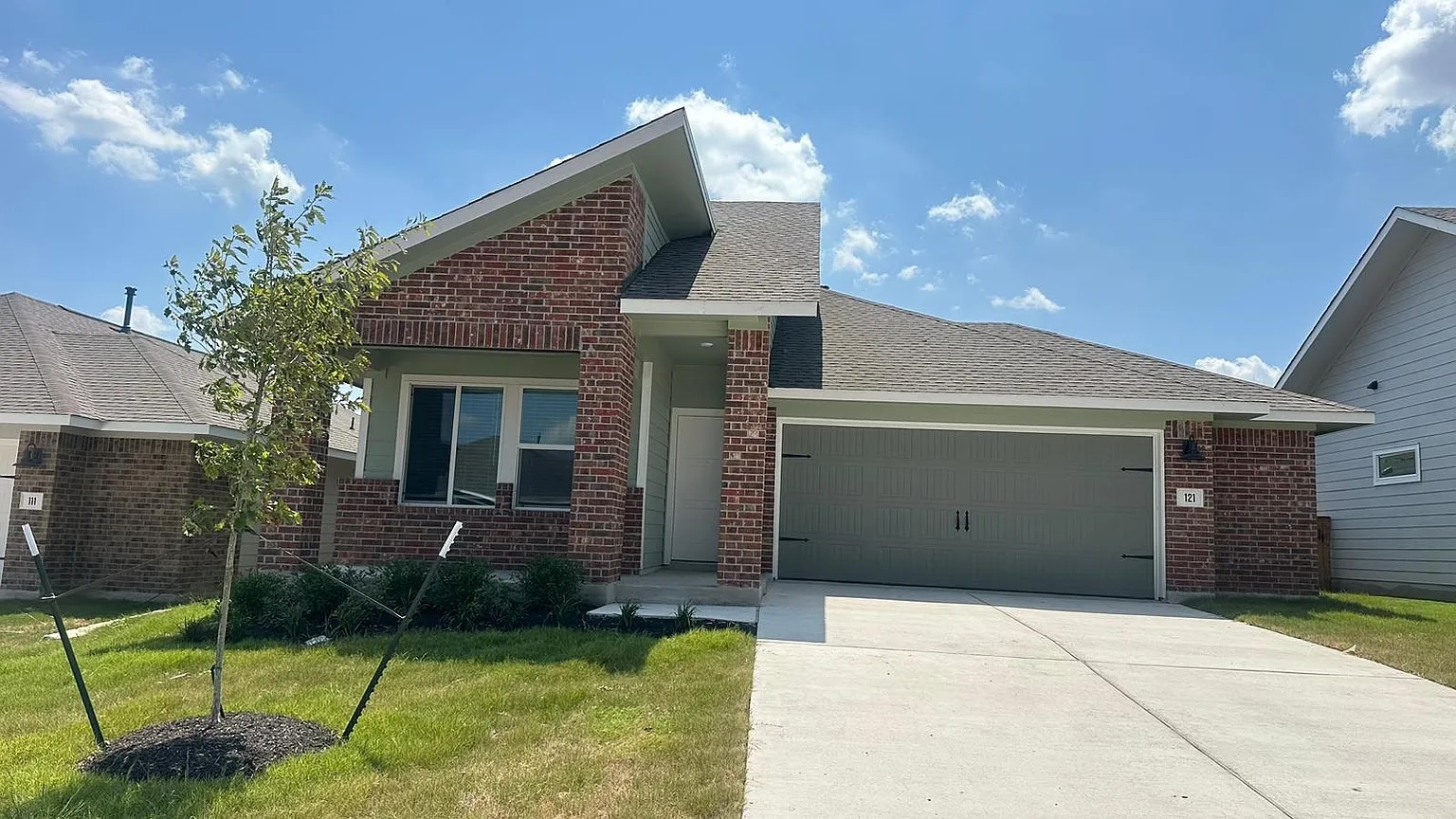 121 Tofalla Kyle, TX 78640 - Photo 2 of 37 a front view of a house with a yard