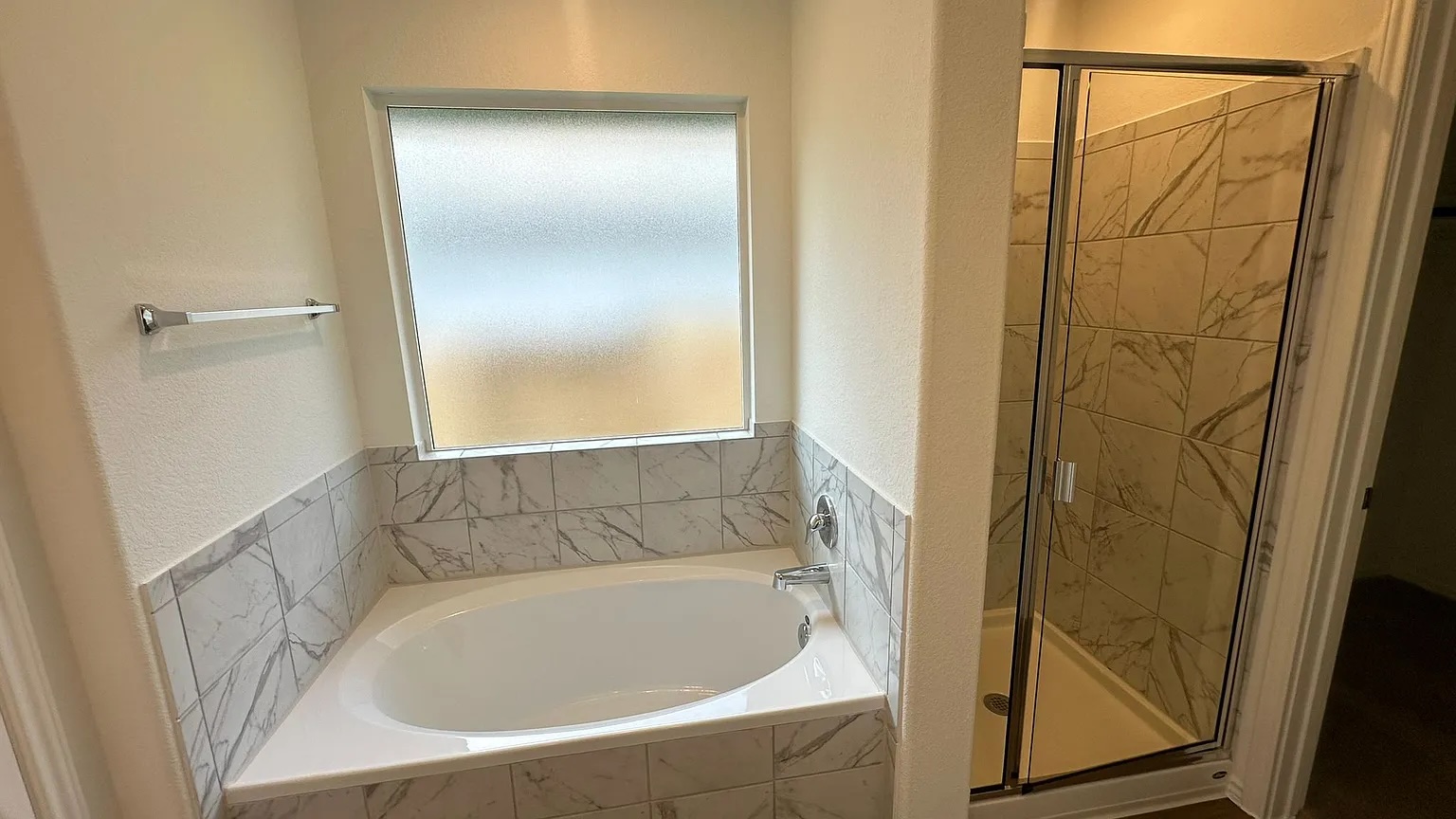 121 Tofalla Kyle, TX 78640 - Photo 20 of 37 a bathroom with a tub and shower