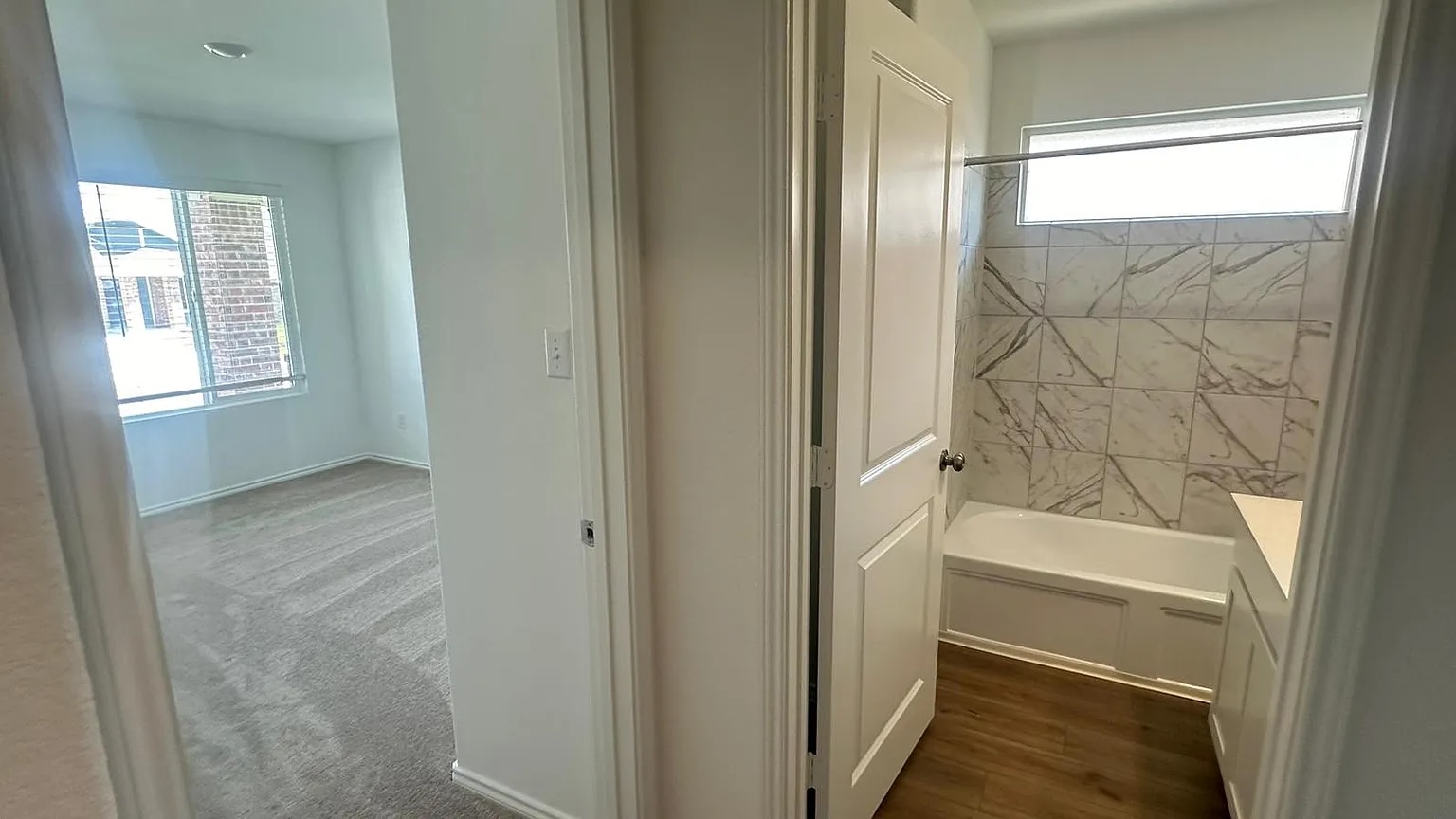 121 Tofalla Kyle, TX 78640 - Photo 26 of 37 a bathroom with a bathtub and a shower