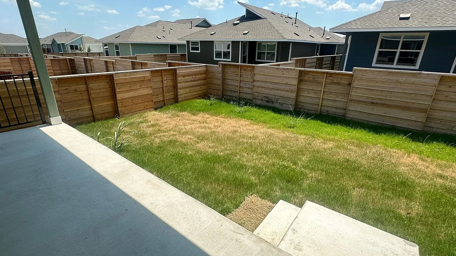 121 Tofalla Kyle, TX 78640 - Photo 32 of 37 a view of a house with a backyard