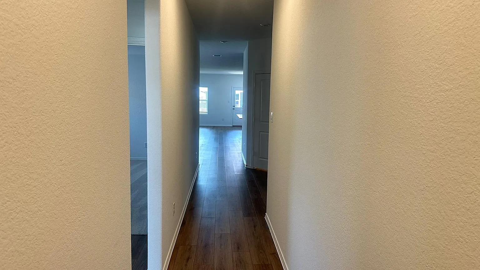 121 Tofalla Kyle, TX 78640 - Photo 4 of 37 a view of a hallway with wooden floor