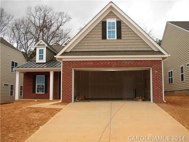 4109 Perth Road, Unit 376 Indian Land, SC 29707 - Photo 1 of 6 a front view of a house with a yard and garage