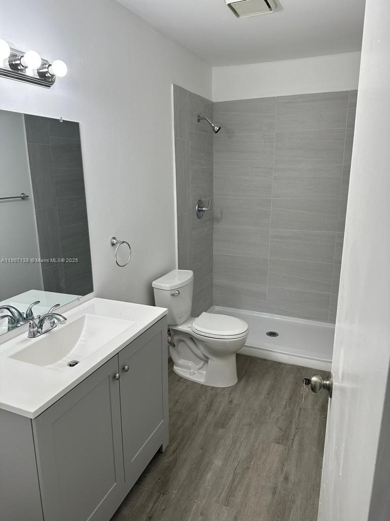 2259 Linton Ridge Circle, Unit G4 Delray Beach, FL 33444 - Photo 13 of 25 a bathroom with a sink a toilet and shower
