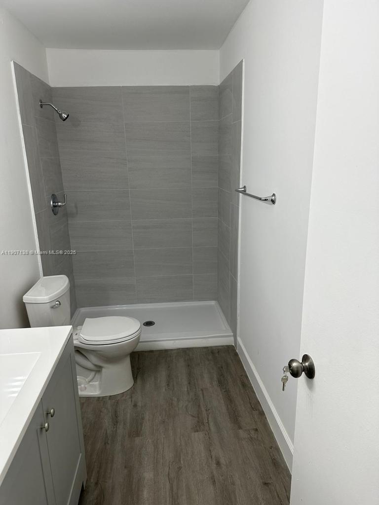 2259 Linton Ridge Circle, Unit G4 Delray Beach, FL 33444 - Photo 15 of 25 a bathroom with a toilet and a shower