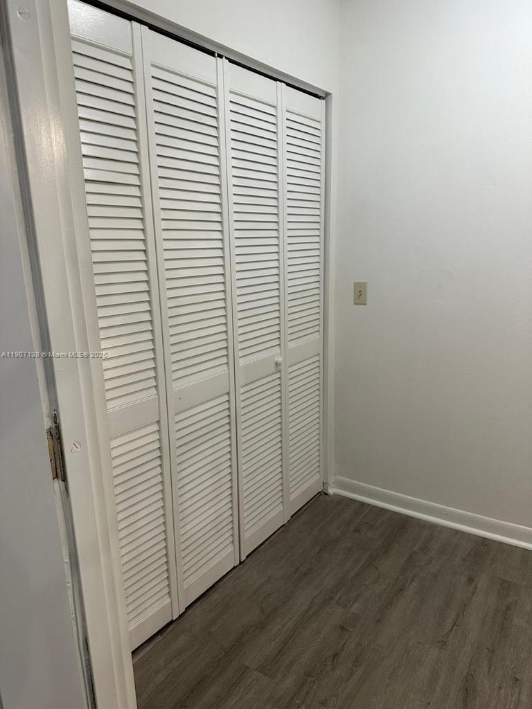 2259 Linton Ridge Circle, Unit G4 Delray Beach, FL 33444 - Photo 19 of 25 an empty room with wooden floor