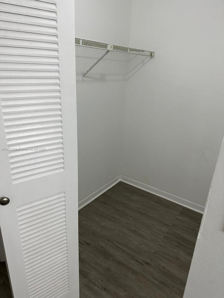 2259 Linton Ridge Circle, Unit G4 Delray Beach, FL 33444 - Photo 24 of 25 a view of a small space with wooden floor and a window