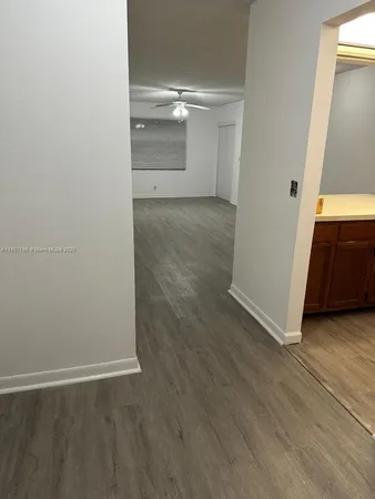 an empty room with wooden floor