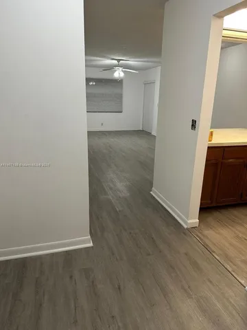 an empty room with wooden floor