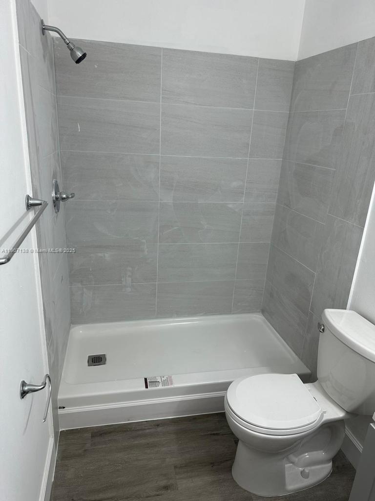 2259 Linton Ridge Circle, Unit G4 Delray Beach, FL 33444 - Photo 10 of 25 a bathroom with a toilet and a shower