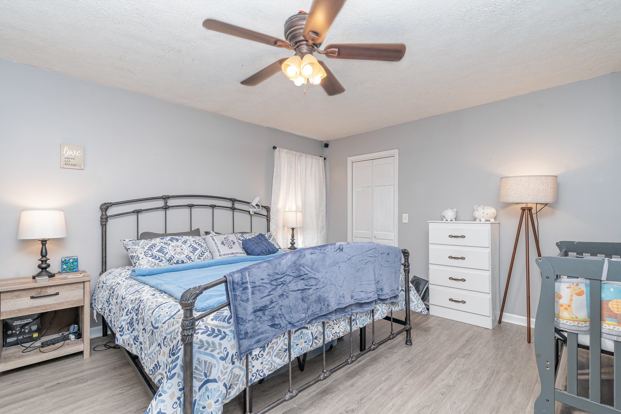 905 Nokes Road Lebanon, TN 37090 - Photo 16 of 30 a bedroom with a bed and a chandelier