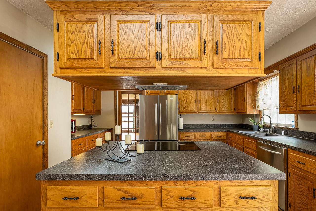 2833 Shutterlee Mill Road Staunton, VA 24401 - Photo 18 of 70 a kitchen with stainless steel appliances granite countertop a sink and cabinets