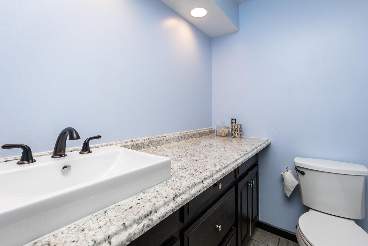 2833 Shutterlee Mill Road Staunton, VA 24401 - Photo 23 of 70 a bathroom with a granite countertop sink a toilet and mirror