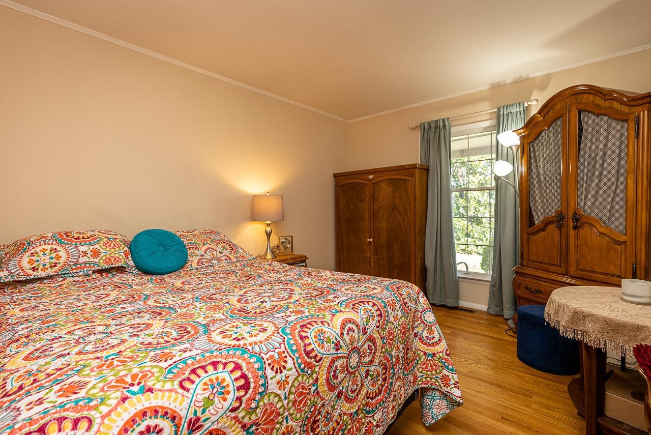 2833 Shutterlee Mill Road Staunton, VA 24401 - Photo 25 of 70 a bedroom with a bed and dresser with mirror